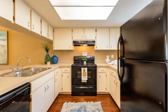 kitchen with all black appliances at Bay Club, Bradenton