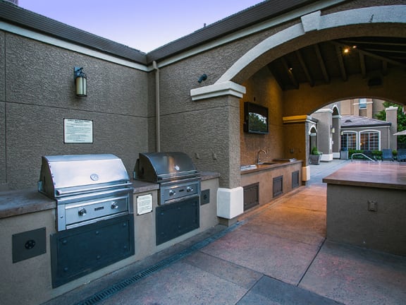 Covered Outdoor Kitchen and Bar with BBQ Grill at Suisun Apartments