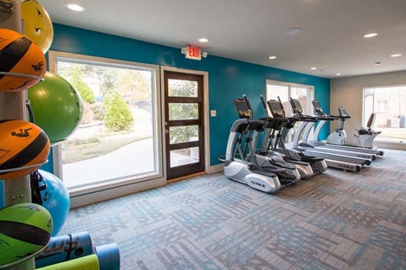 Health and Fitness Center Fully Equipped with Cardio Machines and Yoga Equipment, Complete with a View at Artesian East Village, Atlanta, GA 30316