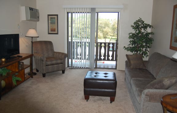Spacious Living Room With Private Balcony at Briarwood Apartments, Benton Harbor, MI, 49022