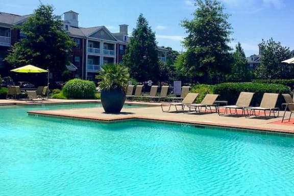 large pool with landscaping and bank of deck chairs at Centerville Manor Apartments, Virginia