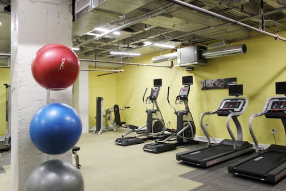 large fitness center with modern workout equipment at Thomas Jefferson Tower, Birmingham