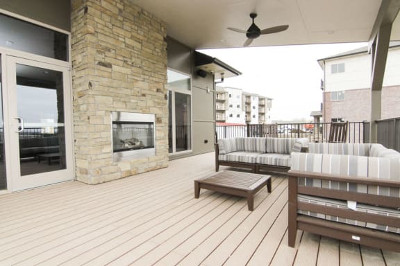Clubhouse at Flats at 84 with outdoor furniture and lounging area