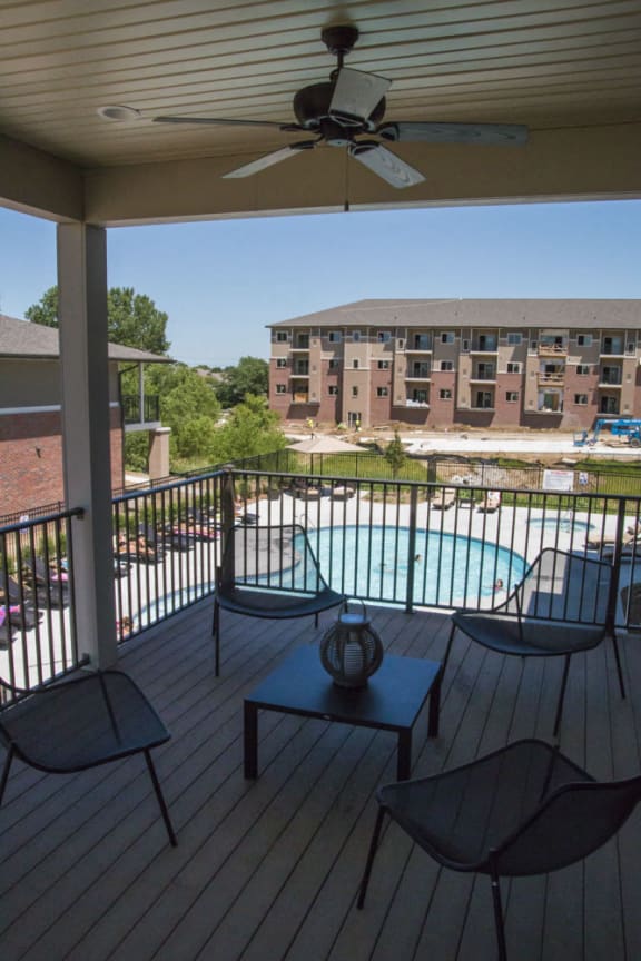 Deck connected to clubhouse overlooking the swimming pool and hot tub Apartment Interior