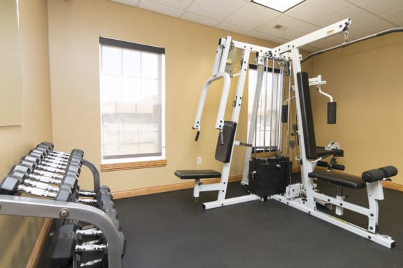 Free weights and workout equipment in the 24 hour fitness center at Williamsburg Park Apartments in South Lincoln, Nebraska