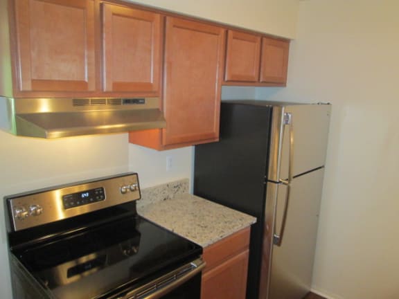 Electric Range In Kitchen at Eastwood Village Apartments, Michigan, 48035