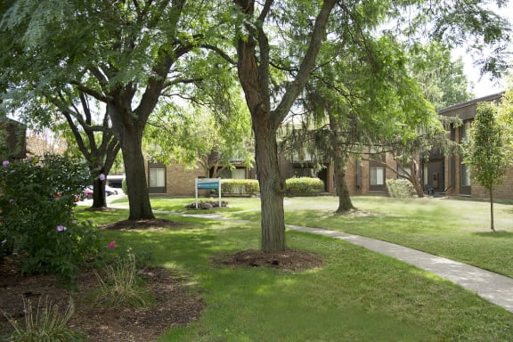 Courtyard with fresh manicured lawns at Westwood Village Apartments, Michigan 48185