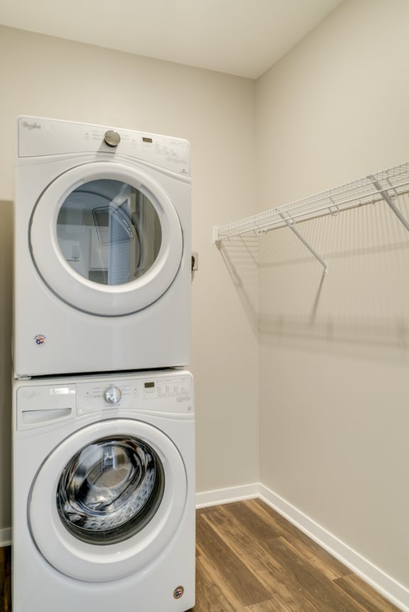 Stacked washer and dryer in laundry room at Ascend at Woodbury in Woodbury, MN