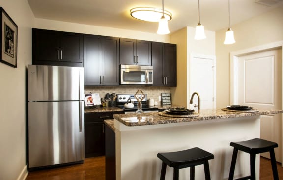 kichen with maple cabinetry and granite countertops at Madison Providence, Collegeville, Pennsylvania