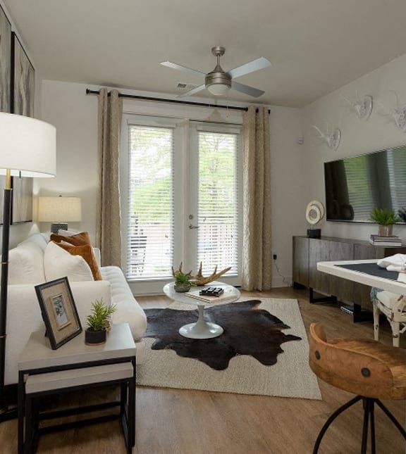 Open Floor Plans with Plenty of Living Space featuring Barn-Style Lighting and Reclaimed Wood-Inspired Flooring at Echo at North Pointe Center Apartment Homes, Alpharetta, GA 30009