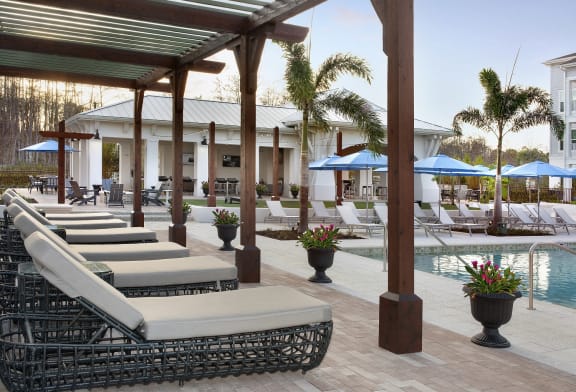 Relaxing Lounge Cabanas by the Refreshing Swimming Pool at The Edison Apartments, Fort Myers, FL 33905