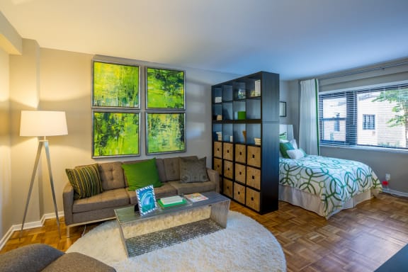 Open living area in studio floorplan with large windows at Bridgeyard in Alexandria, VA