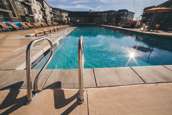 North Main at Steel Ranch Apts in Louisville CO near Cowboy Park l Pool and lounge chairs
