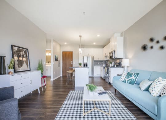 Open floor plan with hardwood floors and white cabinetry at Ascend at Woodbury MN 55129 new luxury apartments