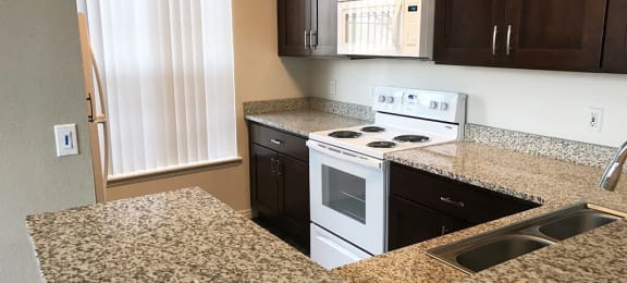 Granite Countertop Kitchen at Pinehurst Apartments, Midvale, Utah