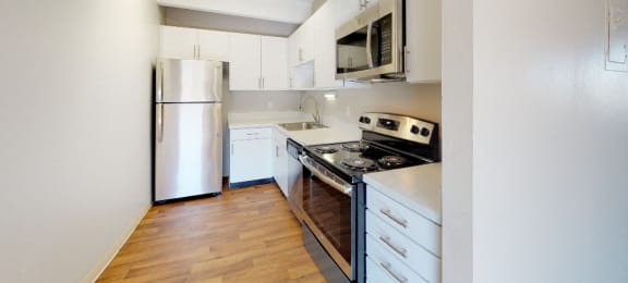 Upgraded stainless steel appliances, quartz countertops, and new cabinets