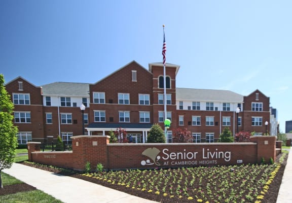 exterior of front apartment building and property sign-Senior Living at Cambridge Heights Apartments, St. Louis, MO