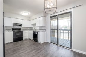 white shaker cabinetry; stainless steel fixtures, affordable apartments;