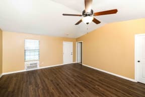 Apartments for Rent in Murfreesboro TN - Open Space Living Room with Stylish Interiors Featuring Hardwood Floors, Ceiling Fan, and Washer and Dryer Connections