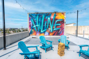 Rooftop Deck with Mural at Hiline Heights  in Houston, TX