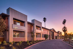 Exterior view of building by street  l Aspire Sacramento Apartments 