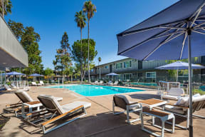 Pool with lounge chairs  l Aspire Sacramento Apartments 