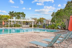Fountains at Forestwood Apartments for rent pool  deck lounge chairs