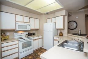 Kitchen with white appliance package | Sedona Springs
