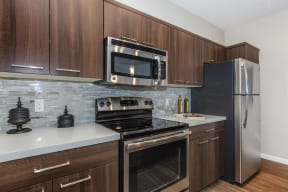 Kitchen with stainless steel appliances | Canyons at Linda Vista Trail