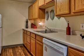 Kitchen appliances include range, refrigerator, dishwasher, and garbage disposal| The Boulders