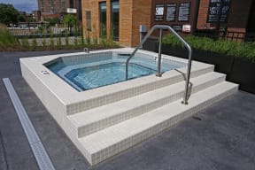Outdoor hot tub located in the community pool deck.