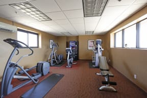 Fitness center with ellipticals and patterned flooring