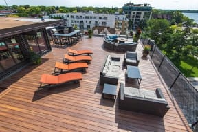 Rooftop lounge area with lounge couches and sunning chairs