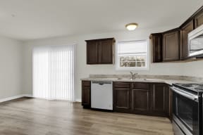mocha cabinets with granite hardwood floors kitchen and dining looking into half bath and living room