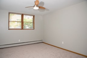 1 bedroom - garden level, ceiling fan and window coverings