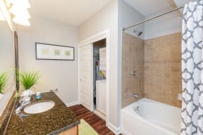 Large Soaking Tub In Master Bathroom With A Tile Surround at 45 Madison Apartments, Missouri