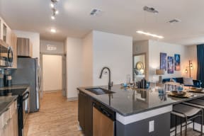 Spacious luxury kitchen with designer amenities in Coda Orlando apartment rentals in Orlando, FL