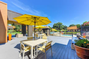 Pool Lounge  Area with Yellow Umbrellas, Grills, Gates with View of Pool