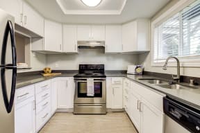 Full kitchen view with stainless steel appliances