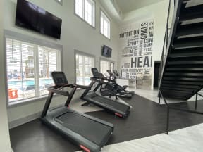 Ladson SC Apartments for Rent - Two-Story Fitness Center Featuring Various Cardio Equipment