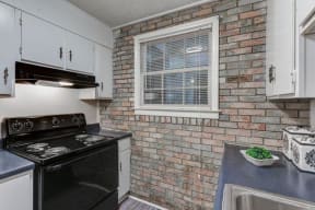kitchen with brick accent wall at The Creek at St Andrews, Columbia, SC, 29210