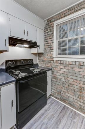 renovated kitchen with black stove at The Creek at St Andrews, Columbia, 29210