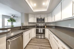 Apartments for Rent in San Clemente, CA - Rancho Del Mar Kitchen with Stainless Steel Appliances, and Modern White Wood Cabinets