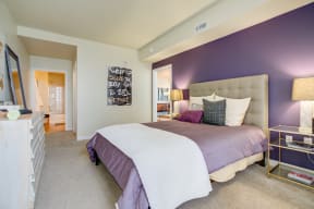 Apartments for Rent in San Jose - Centerra Bedroom with Stylish Decor, Two-Toned Walls, Wall to Wall Carpet, and Access to Bathroom and Main Room