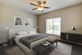 	Fairway Flats Apartments Carpeted Bedroom with Large Window and Ceiling Fan