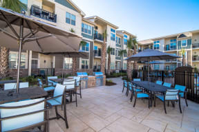 Courtyard Sitting With Umbrella Shades at Meridian at Fairfield Park, Wilmington, NC, 28412