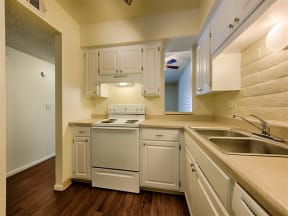 Spacious Kitchen with Pantry Cabinet at Fountain Plaza Apartments, Tucson, AZ