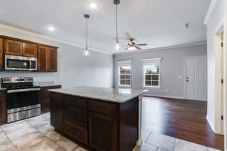 Kitchen With Large Granite Countertop Island
