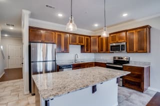 Kitchen With Stainless Steel Appliances &amp; Granite Countertops