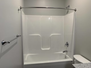 White tub/shower insert with mounted curtain rod